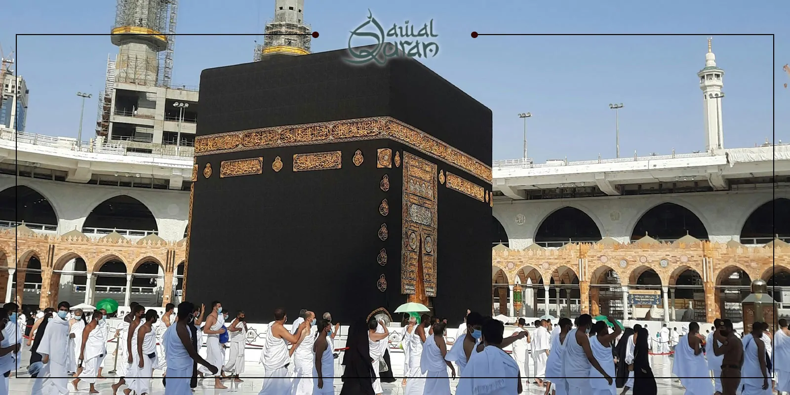 Pilgrims in white robes circling a large black cube during hajj pilgrimage.