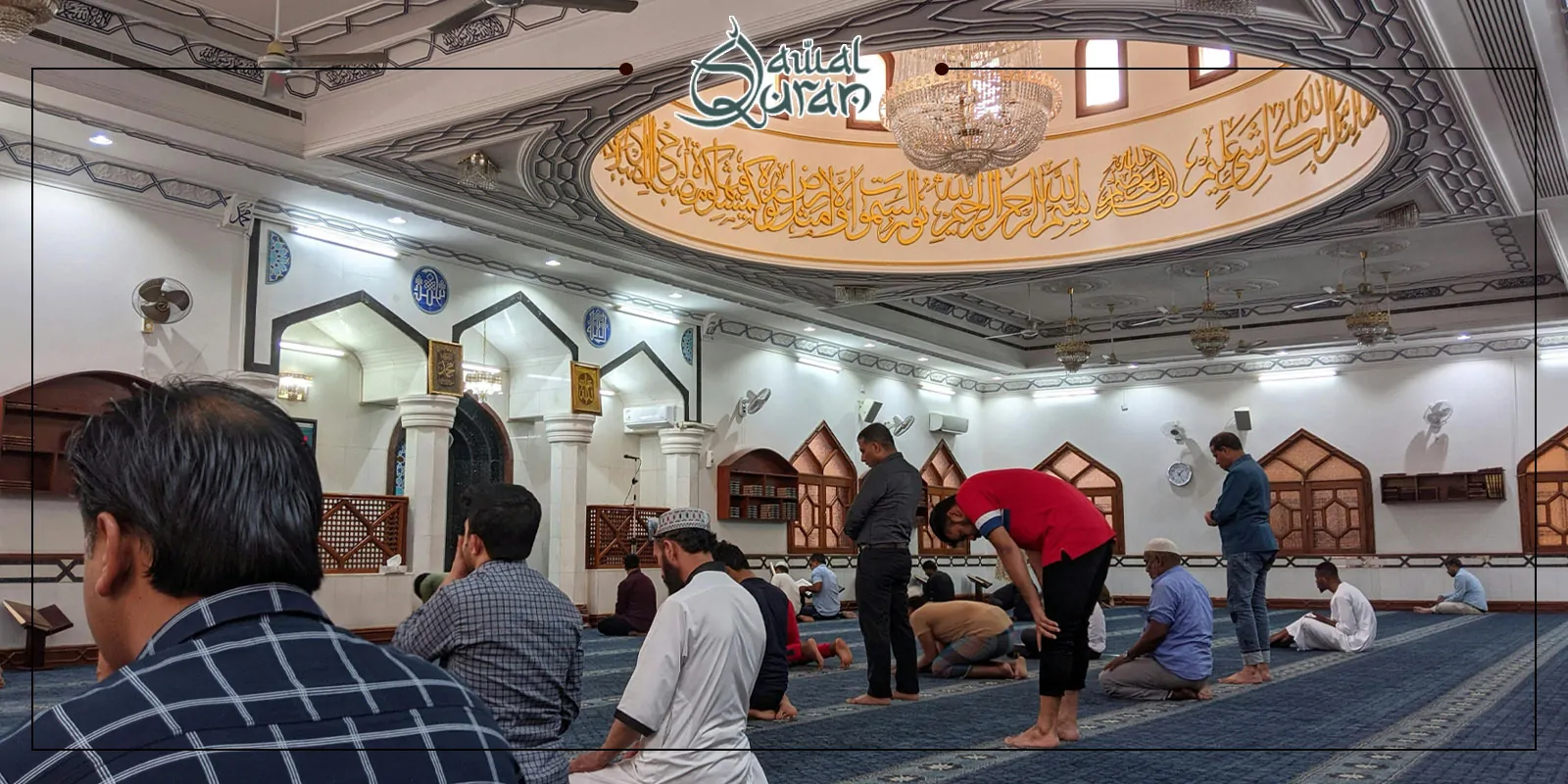People are seated in a mosque, engaged in prayer, with a serene atmosphere surrounding them.