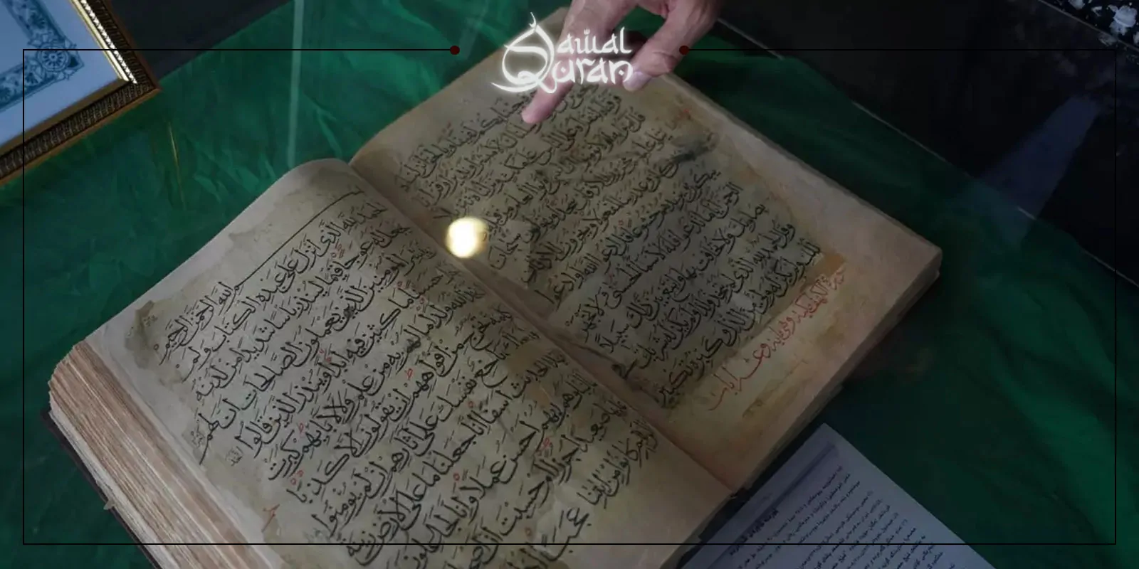 A person points at an illuminated open book, highlighting its pages with a soft light.